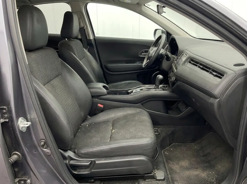 Car interior before detailing — stained seats and dirty floor